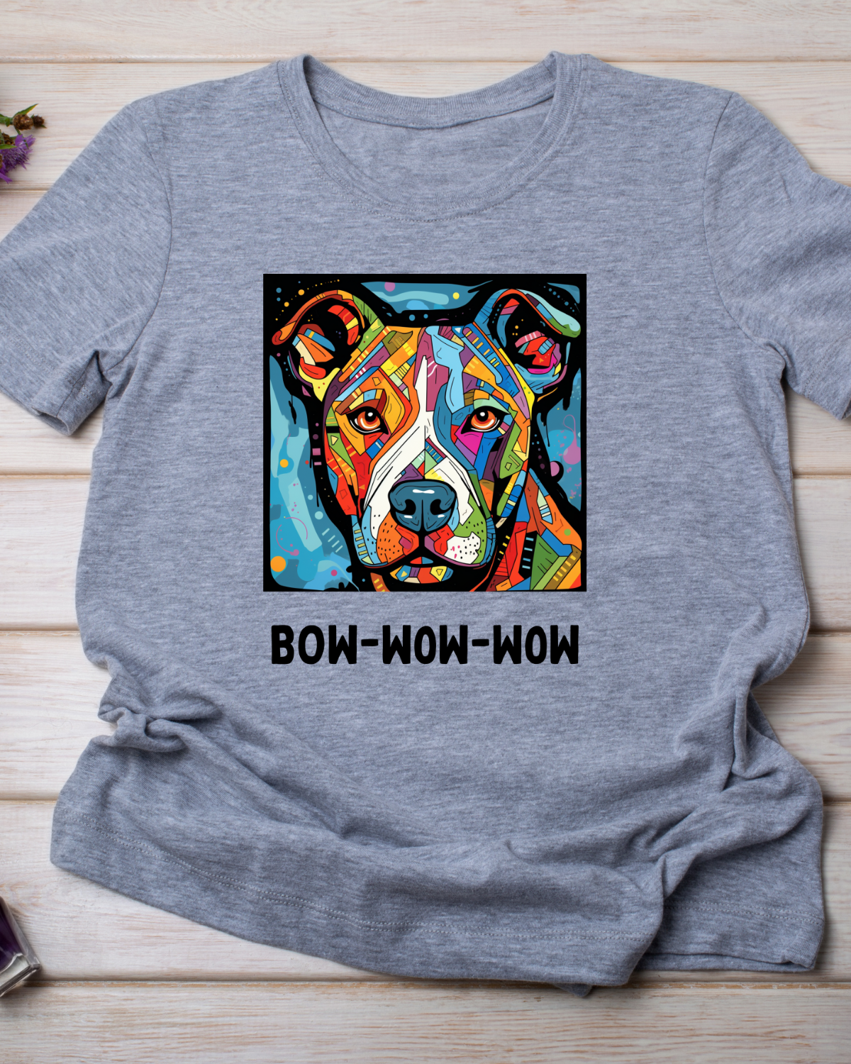 Gray tshirt with a brightly colored pit-bull dog and words bow wow wow under picture.