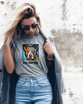 Woman wearing gray tshirt with a colorful pit-bull and the words bow wow wow