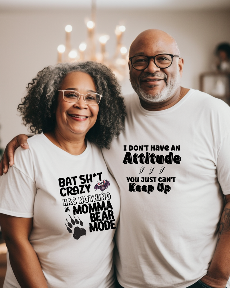 Two people wearing white t-shirts with humorous text designs.