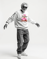 Person wearing a white sweatshirt with colorful text  reading Too Fabulous for candles on a white background